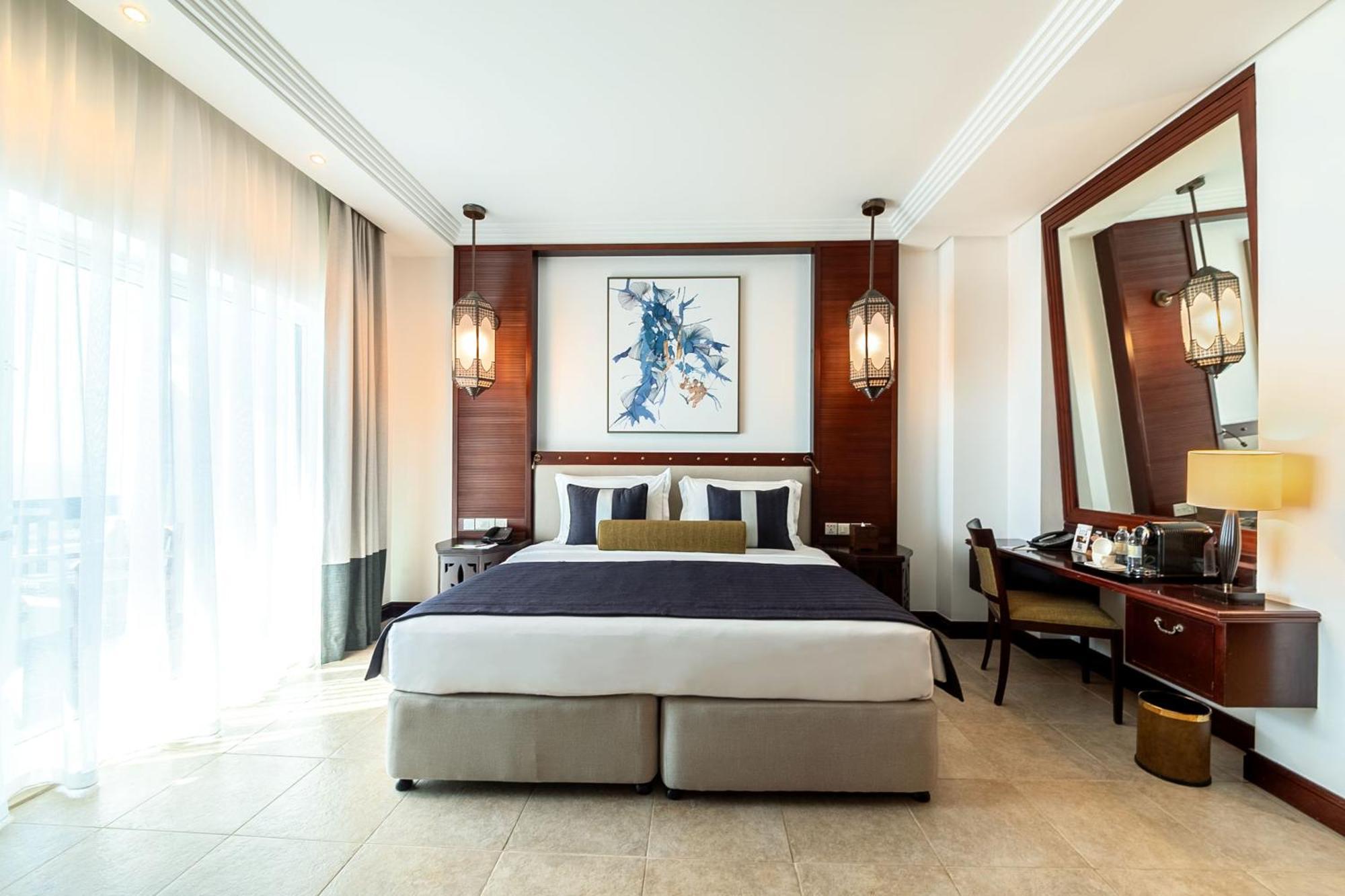 โรงแรมอัจมาน ภายนอก รูปภาพ A bedroom at the hotel